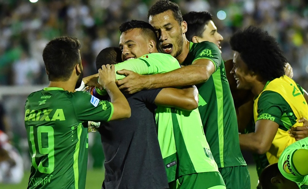 Brazil's Chapecoense footballers celebrate after defeating Argentina's San Lorenzo during their 2016 Copa Sudamericana their 2016 Copa Sudamericana semifinal second leg football match held at Arena Conda stadium, in Chapeco, Brazil, on November 23, 2016. / AFP / NELSON ALMEIDA (Photo credit should read NELSON ALMEIDA/AFP/Getty Images)